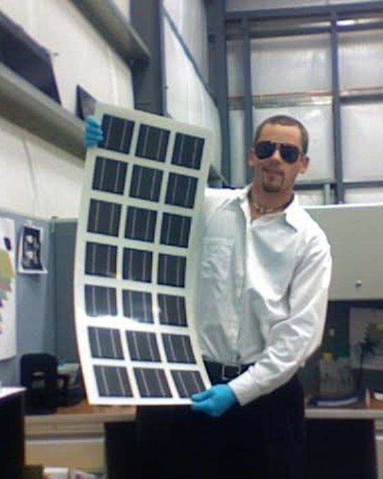 Holding a flexible thin-film module on the manufacturing floor.