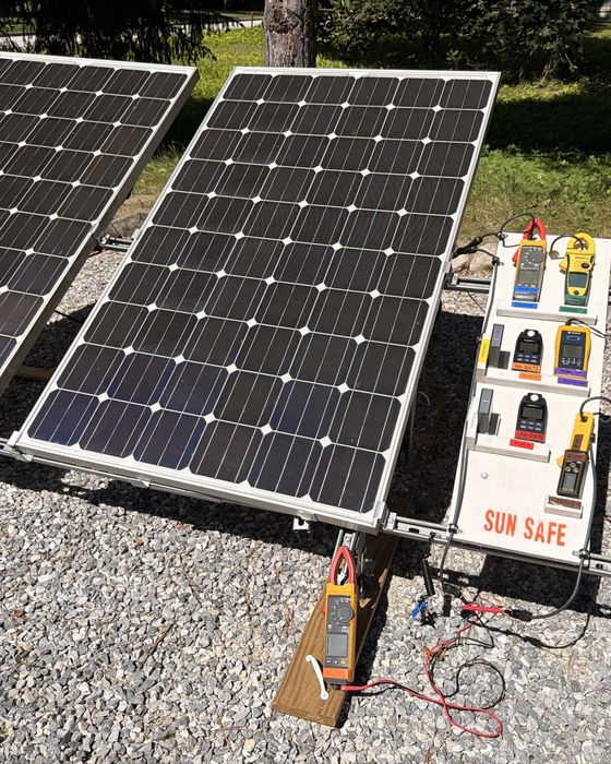 Two panels on the Sun Safe test stand in Rutland, beside a board of handheld meters.